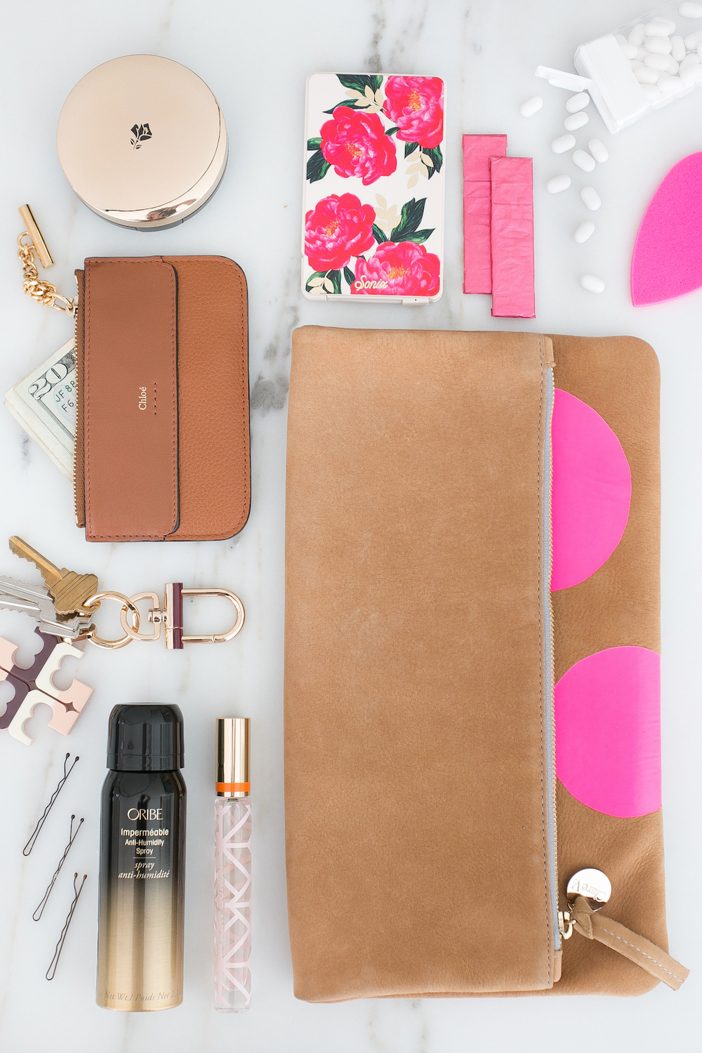 Lancome Oribe Flat Lay Chloe Clutch Essentials Make up Monika Hibbs