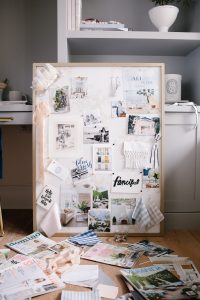 magazine cut outs, fabric swatches, and the DIY pin board behind