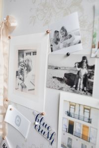 close up of family photos on pin board