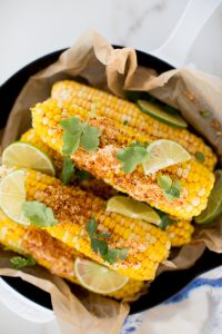 a pan of cilantro chipotle lime Mexican corn on the cob
