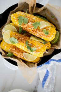 a pan of cilantro chipotle lime corn on the cob