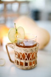 wicker mug with apple cider