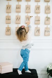 little girl reaching for a bag