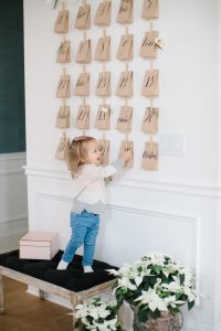 advent on wall with little girl