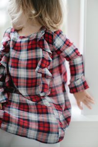 toddler girl in plaid dress