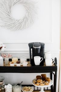 keurig coffee machine, stacked mugs and toppings