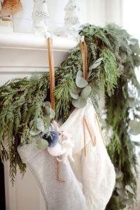 detail of hung stocking and natural green garland
