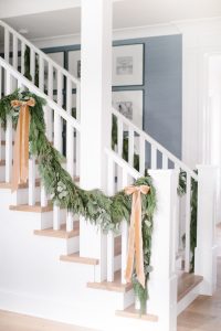 garland on banister with bows