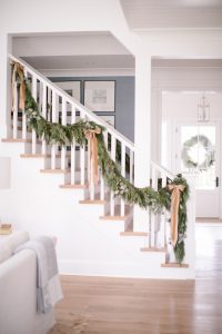 staircase with holiday garland and bows