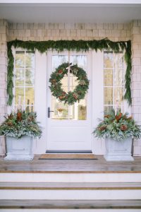 Front door with planter boxes cedar rope and large wreath