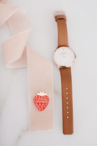 Watch with ribbon beside