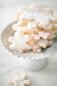 snowflake cookies on cookie stand