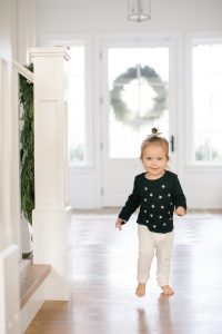 little girl running indoors