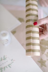 tapping tissue paper around craft tube