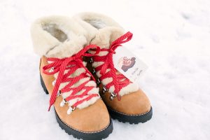 boots in the snow with red laces