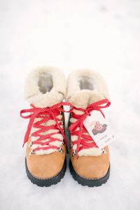 boots on snow with red laces