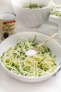 zucchini noddles in pan with coconut cream
