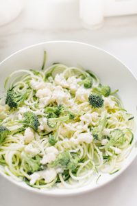 pasta in pan with cauliflower and broccoli florets