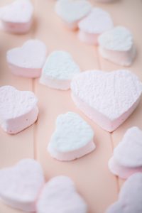 heart marshmallows on pink board