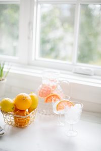 citrus water in jug on counter top