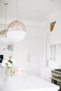 bright white kitchen, built in fridge