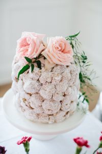 cream puff cake on cake stand florals on top