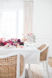 Table scape with beautiful flowers and cake