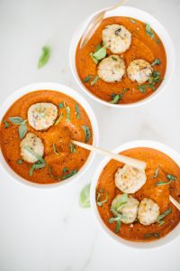 Turkey meatballs in coconut tomato bisque soup with fresh basil