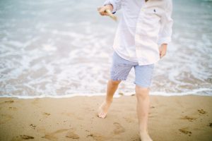 little boy with toes in the sand