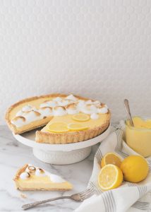 lemon curd tart on cake stand