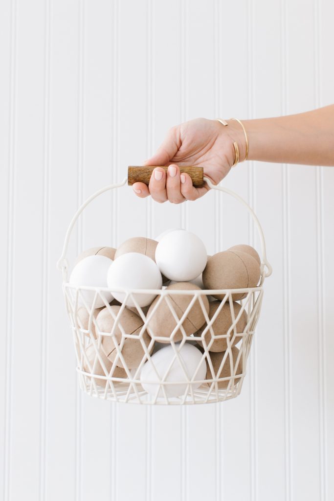 paper mâché eggs in basket