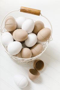 paper easter eggs in white basket