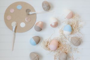 flat lay paper easter eggs and raffia