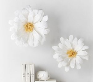 paper daisy on wall
