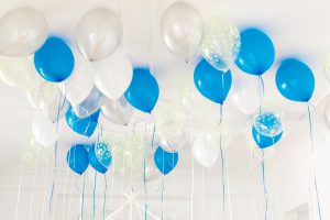 blue and white balloons on celling
