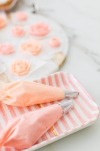 piping bags with pink buttercream