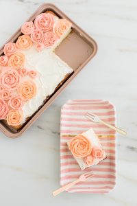 buttercream roses on sheet cake
