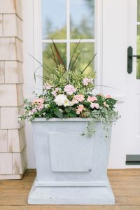large planter box with soft pink flowers