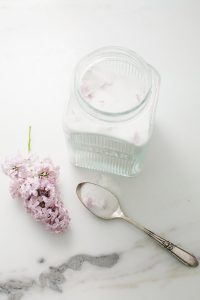 suga jar with lilac and spoon