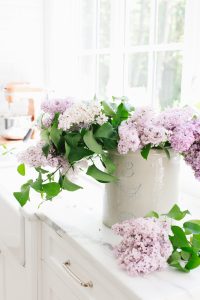 lilacs in crock on kitchen counter