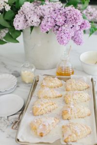 scones with white chocolate drizzle and lilacs