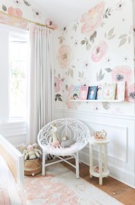 floral wallpaper, white rattan chair