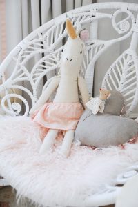 unicorn stuffed animal on chair