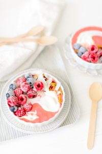 pink smoothie bowl with yoghurt swirl
