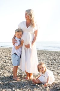 mom on beach pregnant white dress, with kids