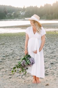 white dress on beach with lilacs
