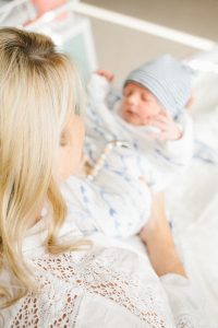 newborn with striped hat