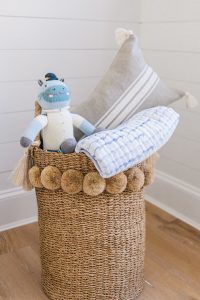 pompom wicker basket in nursery