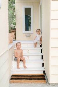 kids on back porch steps in summer