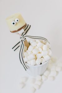 white cocoa spoons in marshmallow cups